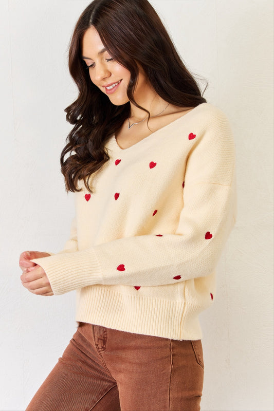 Fall in love with our Charlotte Mini Hearts V-Neck Sweater. Perfect for snuggly nights in or a romantic date, this sweater will have you feeling the love no matter the season. knitwear, valentines sweater,