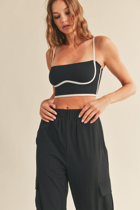 Get the best of both worlds with the Lily Contrasting Sculpting Cami. Designed for light to medium support. The contrast piping detail adds a chic touch, while adjustable straps ensure a perfect fit for all-day comfort and confidence. Stay supported and stylish.