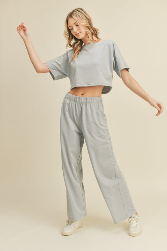 Indulge in the comfort of the Kimberly Cropped Top and Wide Leg Pants Lounge Set, offering a baby soft feel against your skin. The relaxed fit ensures unrestricted movement, creating a laid-back vibe perfect for unwinding at home or tackling casual errands. With its stylish design and cozy feel, this lounge set is your go-to choice for leisurely days or evenings spent in pure relaxation.