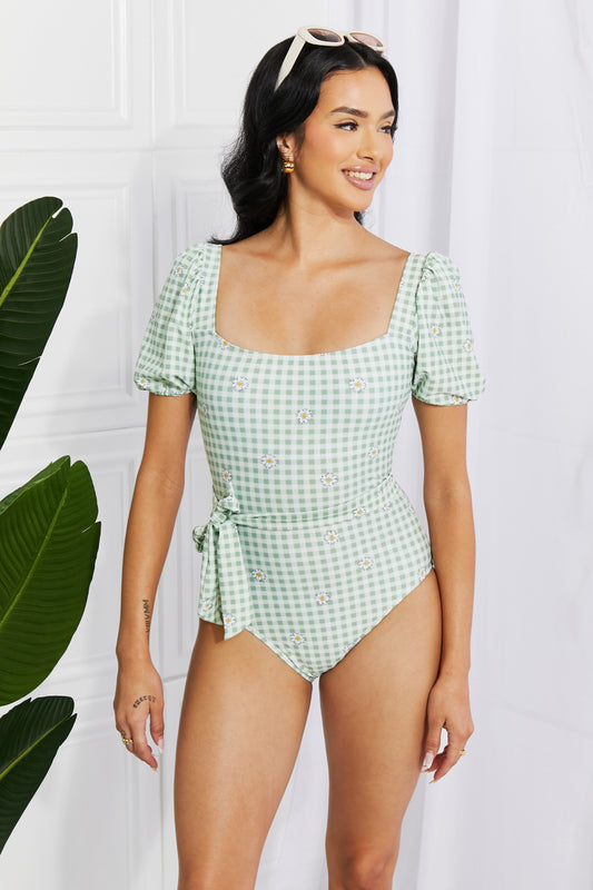 Sweet as can be, this cottage-core swimsuit offers lots of coverage, comfort, and a cute print. The puff sleeves add volume and the optional tie belt can be worn to emphasize your waist. Wear with or without the padding according to your preference.  Top: No underwire Chest pad: Removable padding Models are wearing sizes S and 2XL.
