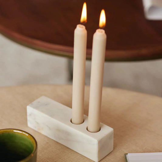 Maker: Fleck
This solid, gorgeous marble candle holder is a bold addition to any space. Made with a single piece of marble, each one of them is unique & highlights the natural veins of the marble. 
Dimensions:  4.5 x 4.5 x 16 cms / 1.75" x 1.75" x 6.3"
 