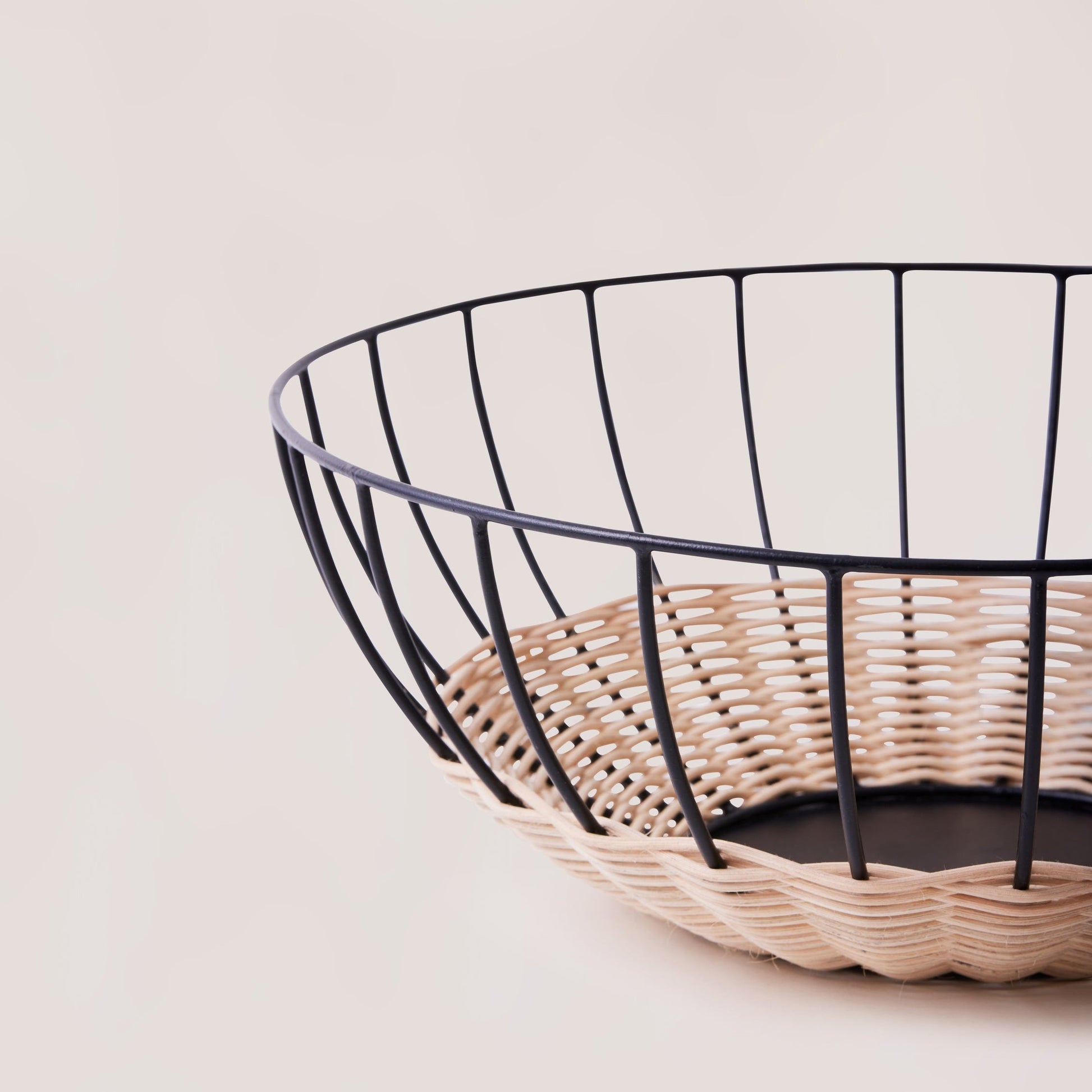 The Cabo Rattan Basket turns your grocery store produce into a beautiful still-life piece. Woven with natural rattan, this airy basket would elevate your centrepiece display of fruit, vegetables or ornamental objects. 
    * Natural Rattan on Powder coated Iron
    * Size:  35 cms Width x 12 cms Height / 13.8" round x 4.72" Height
Note: Please keep away from high moisture places. Wipe clean with a dry soft cloth. 