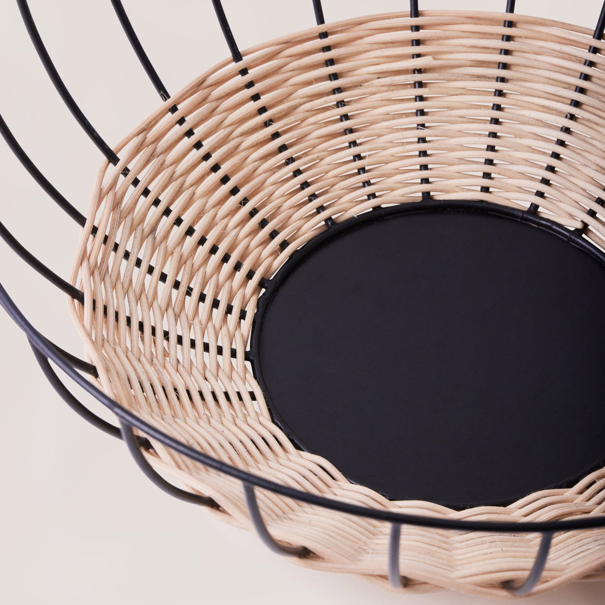 The Cabo Rattan Basket turns your grocery store produce into a beautiful still-life piece. Woven with natural rattan, this airy basket would elevate your centrepiece display of fruit, vegetables or ornamental objects. 
    * Natural Rattan on Powder coated Iron
    * Size:  35 cms Width x 12 cms Height / 13.8" round x 4.72" Height
Note: Please keep away from high moisture places. Wipe clean with a dry soft cloth. 