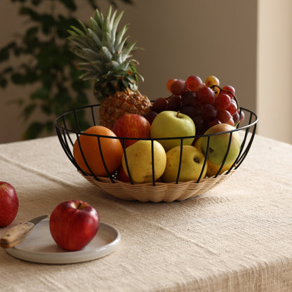 The Cabo Rattan Basket turns your grocery store produce into a beautiful still-life piece. Woven with natural rattan, this airy basket would elevate your centrepiece display of fruit, vegetables or ornamental objects. 
    * Natural Rattan on Powder coated Iron
    * Size:  35 cms Width x 12 cms Height / 13.8" round x 4.72" Height
Note: Please keep away from high moisture places. Wipe clean with a dry soft cloth. 