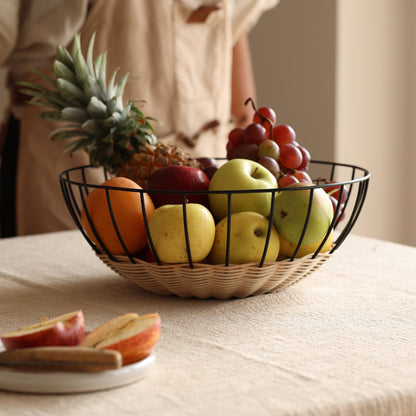 The Cabo Rattan Basket turns your grocery store produce into a beautiful still-life piece. Woven with natural rattan, this airy basket would elevate your centrepiece display of fruit, vegetables or ornamental objects. 
    * Natural Rattan on Powder coated Iron
    * Size:  35 cms Width x 12 cms Height / 13.8" round x 4.72" Height
Note: Please keep away from high moisture places. Wipe clean with a dry soft cloth. 