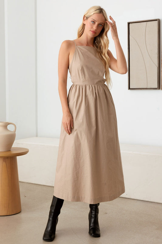 The Mabel Backless Cami Dress is a stylish and contemporary option for a variety of occasions, allowing you to show off some skin while still maintaining a sleek and elegant look. This style of dress is great for summer events, parties, or a night out on the town.