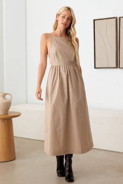 The Mabel Backless Cami Dress is a stylish and contemporary option for a variety of occasions, allowing you to show off some skin while still maintaining a sleek and elegant look. This style of dress is great for summer events, parties, or a night out on the town.