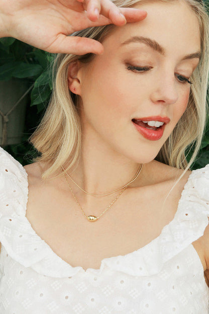 Double up your style game with Nora Oval Pendant Necklace! This stunning necklace is perfect for adding a touch of elegance to any outfit. With its nickel-free material, you can wear it comfortably all day long. Who says you can't have it all?!? 