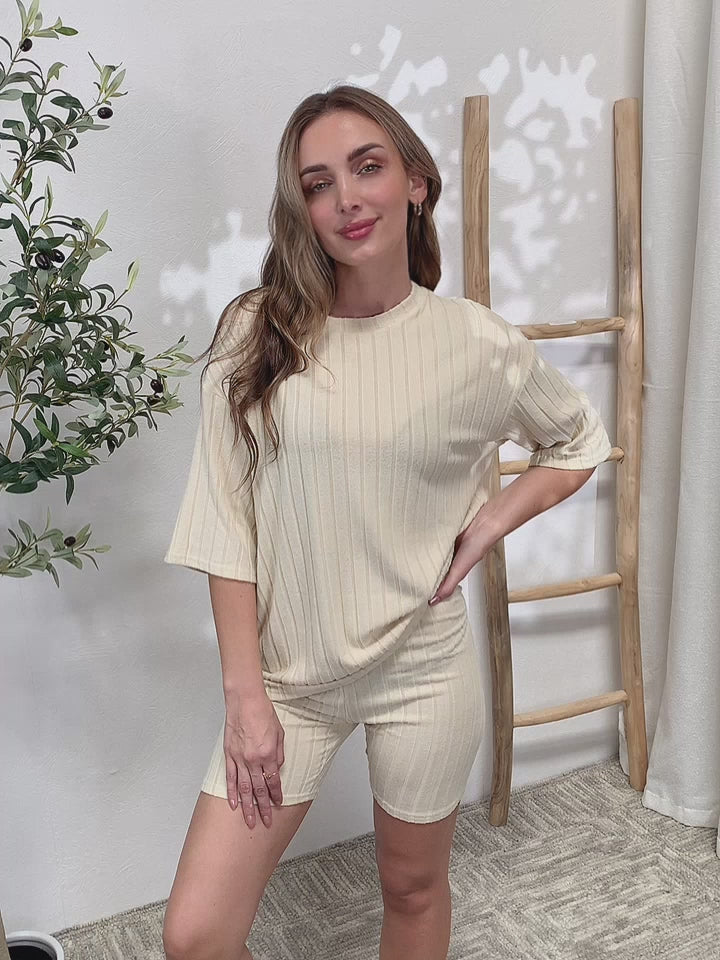 The Ribbed Round Neck Top and Shorts Lounge Set is a comfortable and stylish option for loungewear or casual wear. With its ribbed texture and matching top and shorts, this set provides a coordinated and trendy look while offering maximum comfort. Lounge Wear