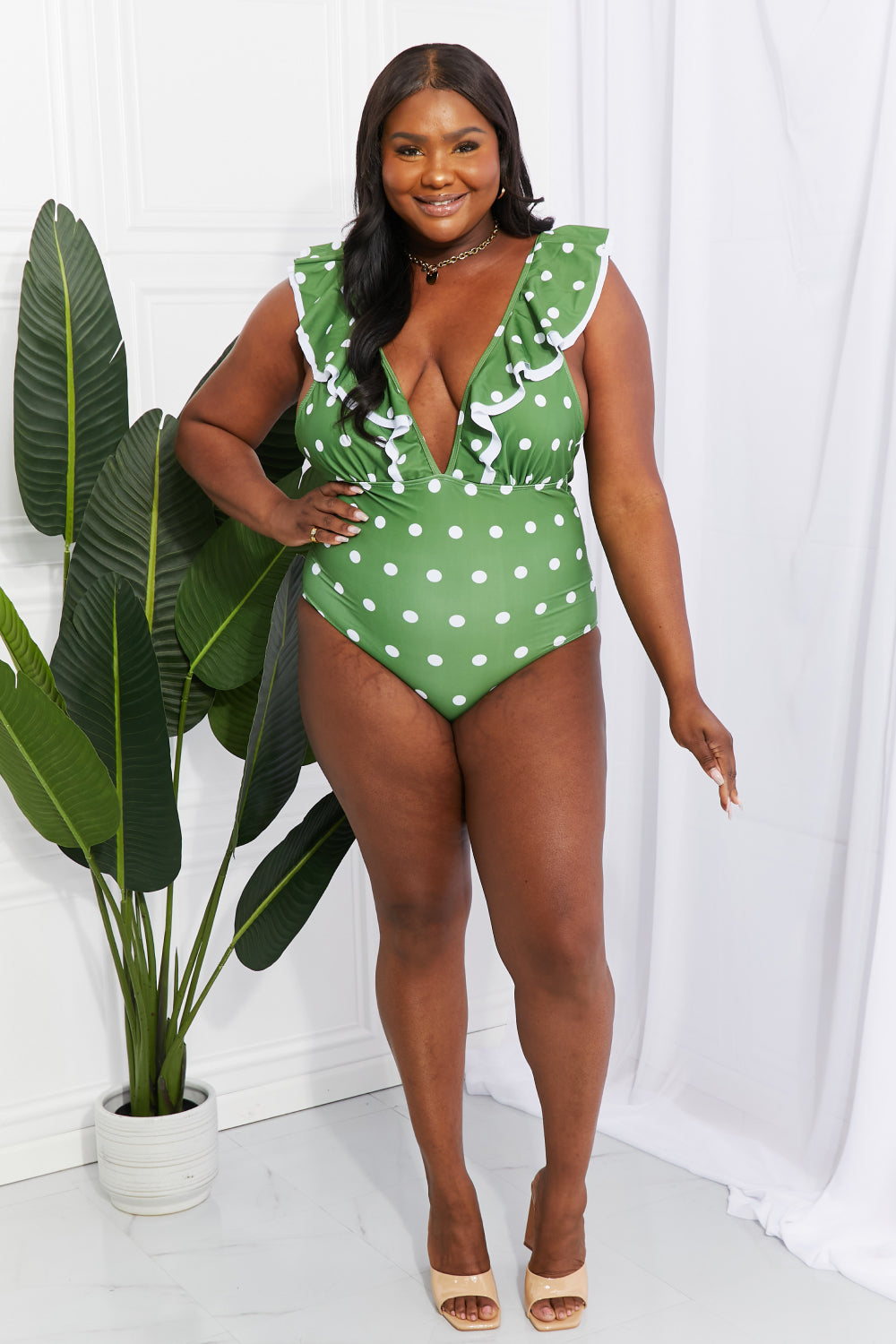 Make your inner beach babe shine by wearing a suit that makes you feel confident. This one is designed with a deep neckline and a ruffle trim. You can get double the use of this swimsuit by styling it as a bodysuit under a skirt or pair of jeans. Note: Runs small, order one size up. If between sizes or have a long torso, please size up.