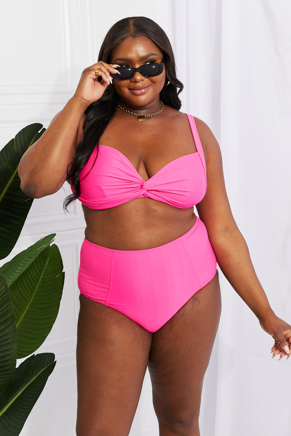 Get ready for a splash with Take A Dip Twist High-Rise Bikini in Pink! This flirty twist-front top and flattering high-rise bottoms are sure to satisfy all your summer cravings. With customizable removable pads, this suit will quickly become your go-to for beach days. Note: Runs small, order one size up. If between sizes, please size up. Models are wearing sizes S and 2XL.