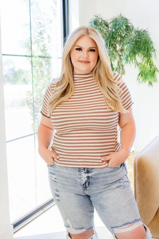 Look and feel classic and timeless in our Nostalgic Note Striped Mock Neck Top! Crafted from a textured knit, this top features a mock neckline, short sleeves, and a fitted silhouette to flatter your figure. The classic stripe pattern brings a touch of nostalgia to your outfit!