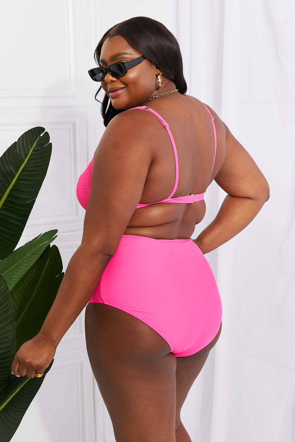 Get ready for a splash with Take A Dip Twist High-Rise Bikini in Pink! This flirty twist-front top and flattering high-rise bottoms are sure to satisfy all your summer cravings. With customizable removable pads, this suit will quickly become your go-to for beach days. Note: Runs small, order one size up. If between sizes, please size up. Models are wearing sizes S and 2XL.