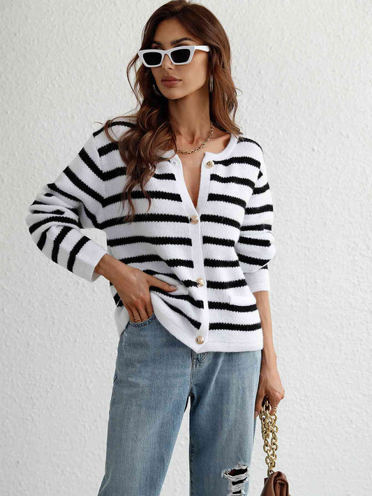 Introducing our Striped Button Front Cardigan by Woven Right – a perfect fusion of casual comfort and timeless elegance. This cardigan, adorned with sophisticated stripes, effortlessly marries a laid-back vibe with a touch of class. The round neck and button front add subtle detailing to the ensemble.
